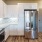 a kitchen with white cabinets