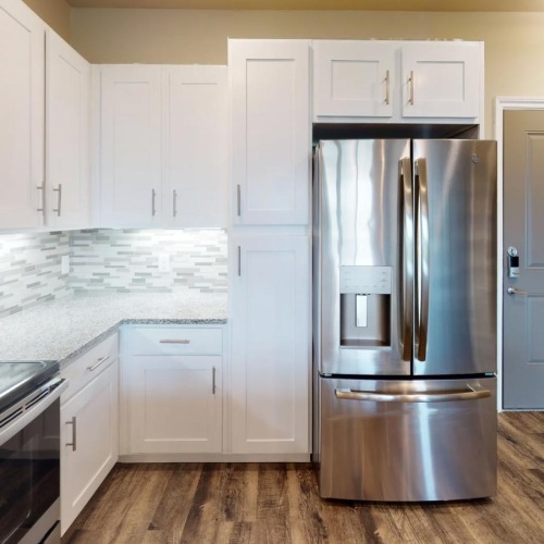 Spacious kitchens with thoughtful details a kitchen with white cabinets