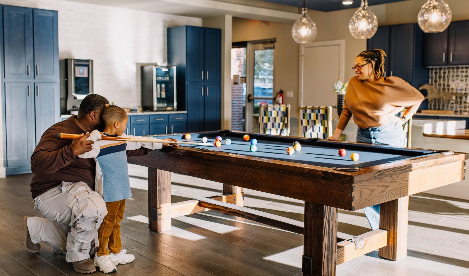 Sparkling swimming pool a person and a couple of kids playing pool
