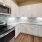 a kitchen with white cabinets