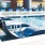 a pool with chairs around it