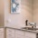 a kitchen with white cabinets