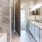 a bathroom with a tub sink and a shower