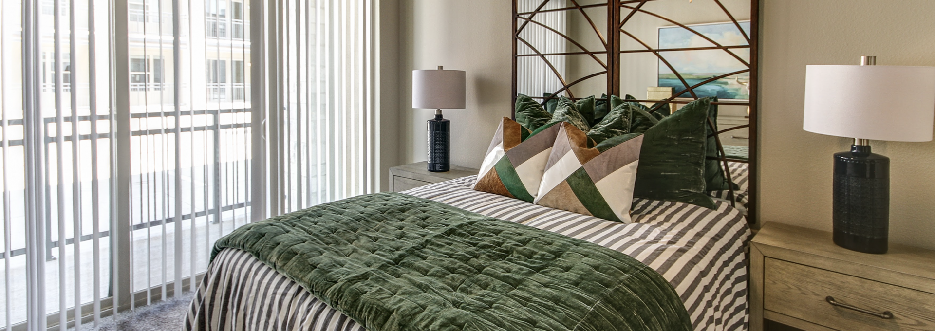 a bedroom with a green and white bedspread at The Gates at Meadow Place